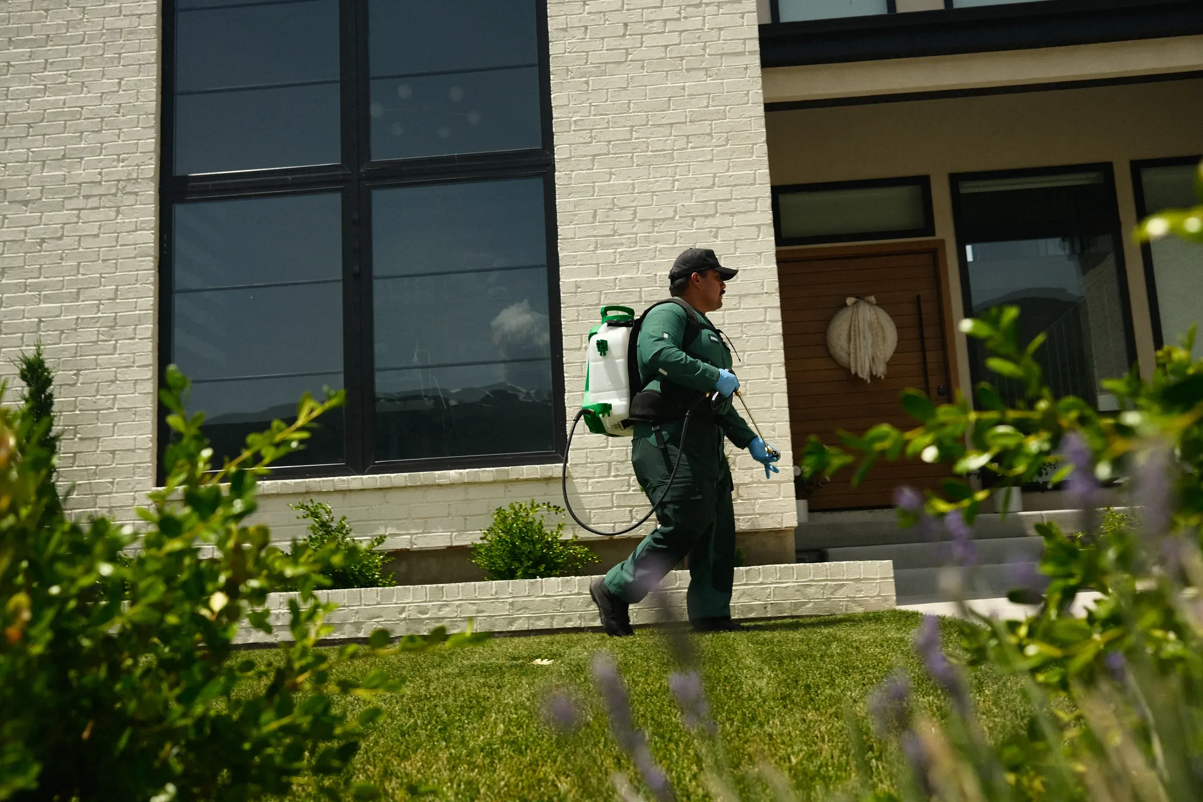 A RIDD technician on a residential pest control call in Romeo, MI.